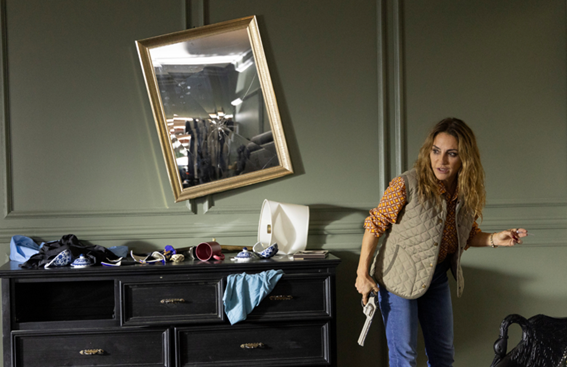 A person holding an object in front of a dresserAI-generated content may be incorrect.